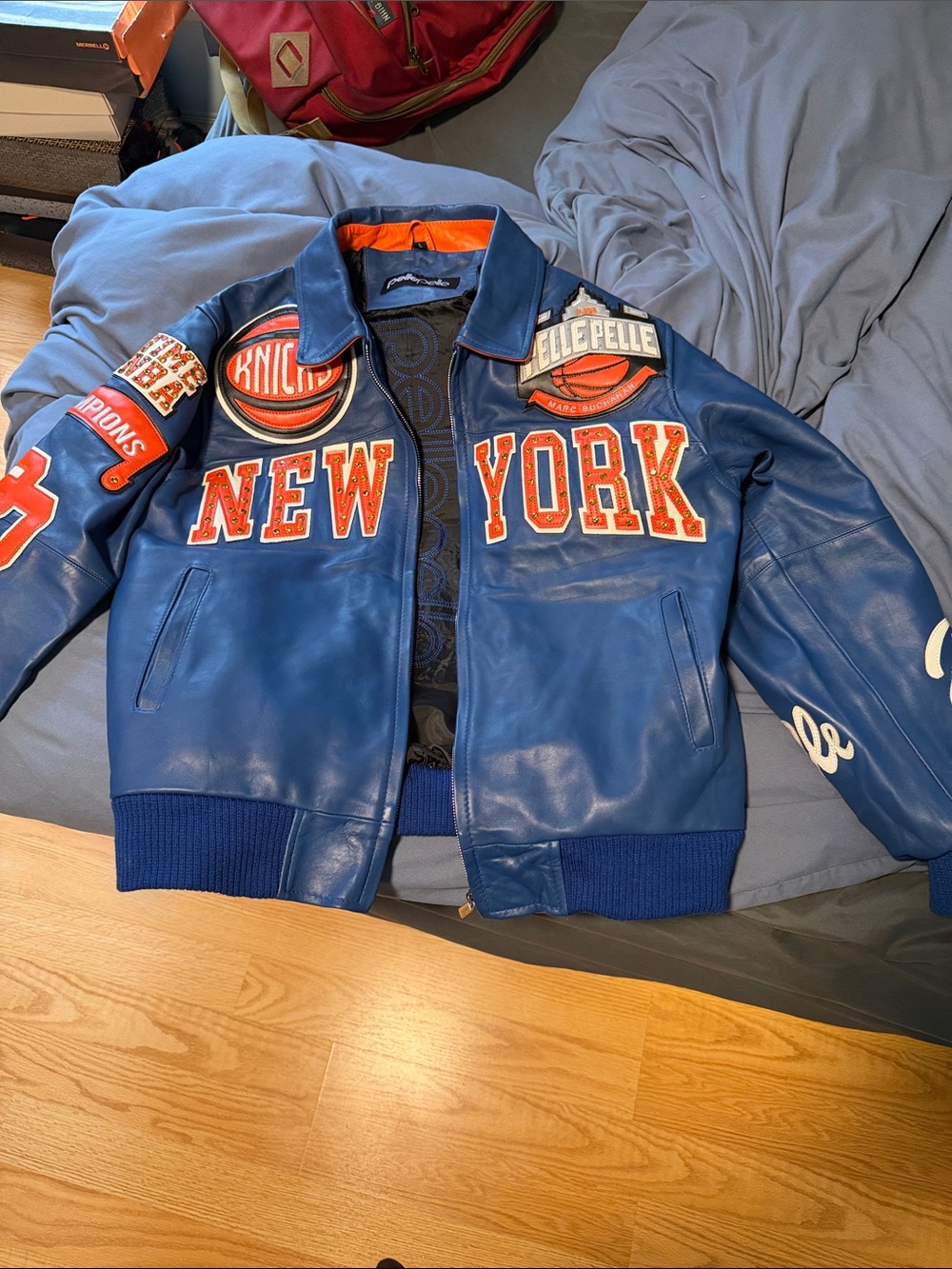 Pelle Pelle Blue Leather 'New York' Varsity Jacket with Orange Lettering